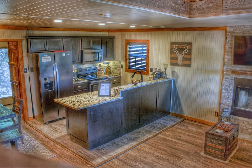 Fully equipped kitchen featuring granite complete with pots, pans & knife set!