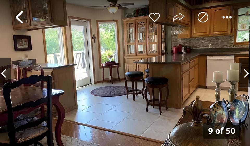 Upstairs dining area adjacent to the kitchen and living area and sunroom.