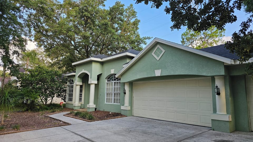 home front w trees and natural landscaping