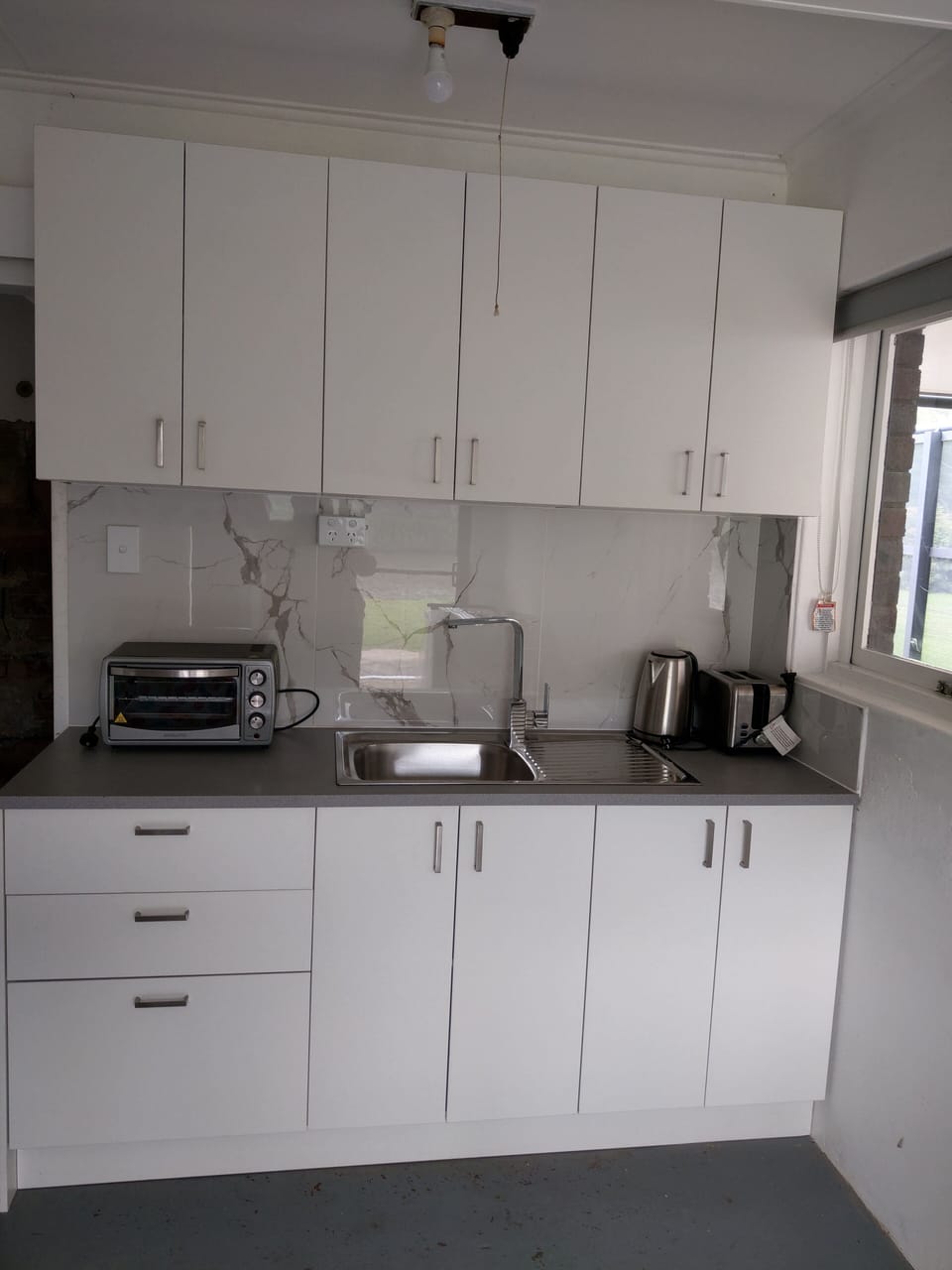Downstairs kitchenette servicing 6 people