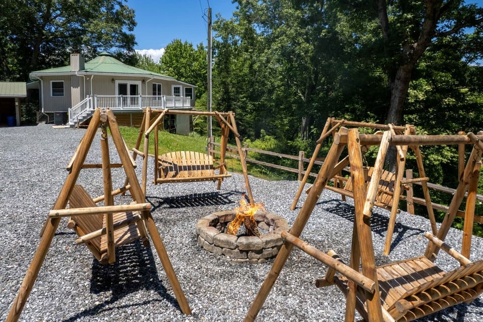 Outdoor Area - Outdoor fire pit area with wooden swings