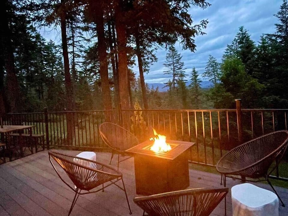 Big sky evening views with Glacier National Park range as a backdrop. Elevated deck has a treetop feel - 25 feet of lounging space.
