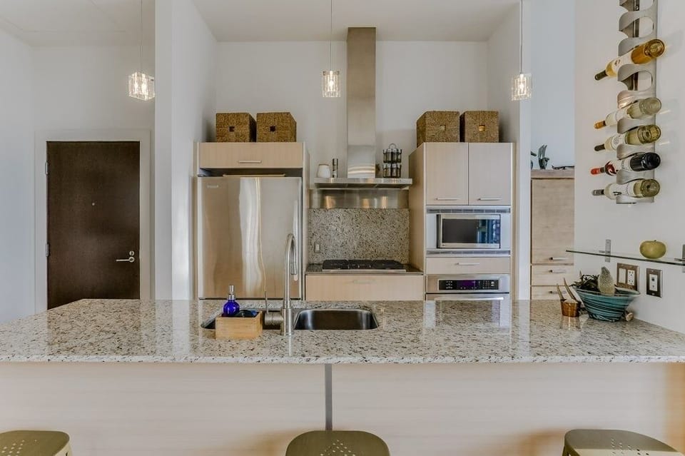 Kitchen with gas-top stove and stainless appliances 