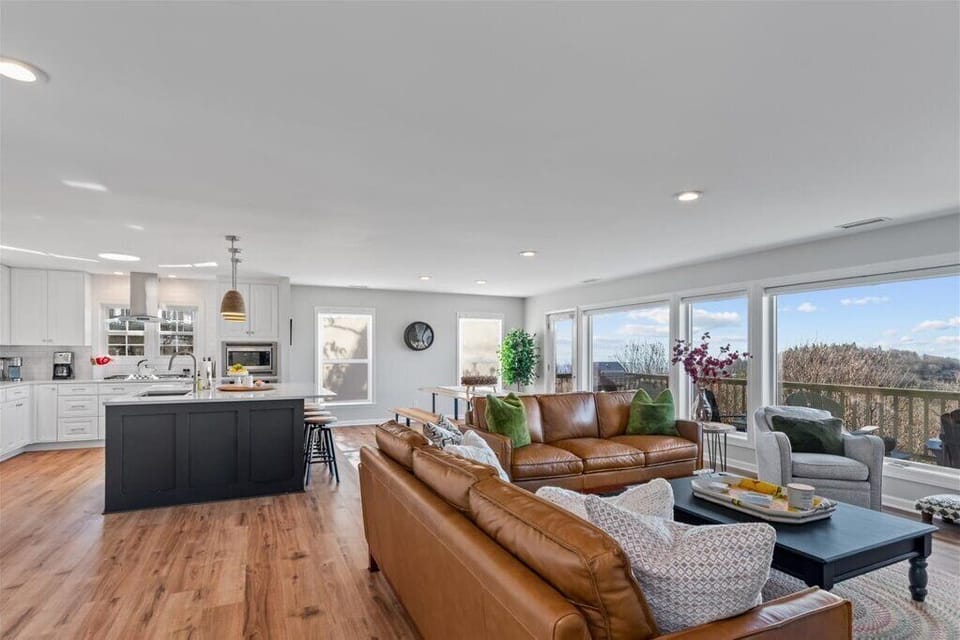 Two supple leather sofas & a swiveling chair offer views for everyone