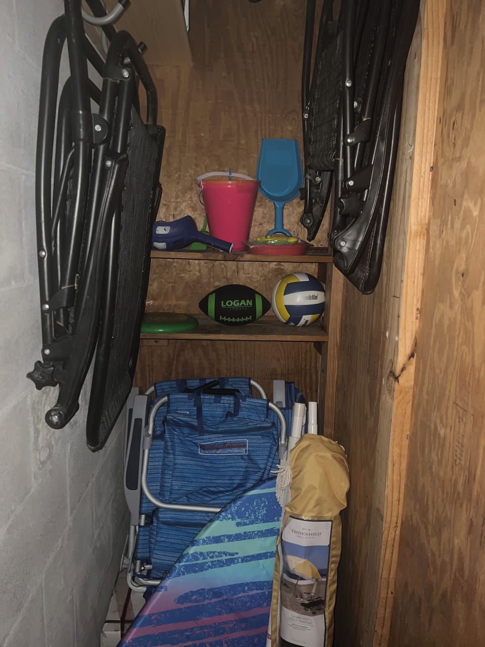 Storage Closet filled with 6 chairs, sun umbrella, sand toys and more!