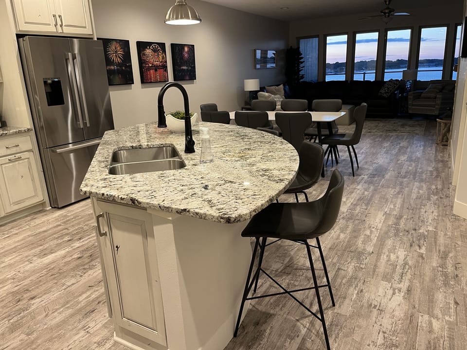 Open floor plan allows conversations and lake views and sunsets while cooking