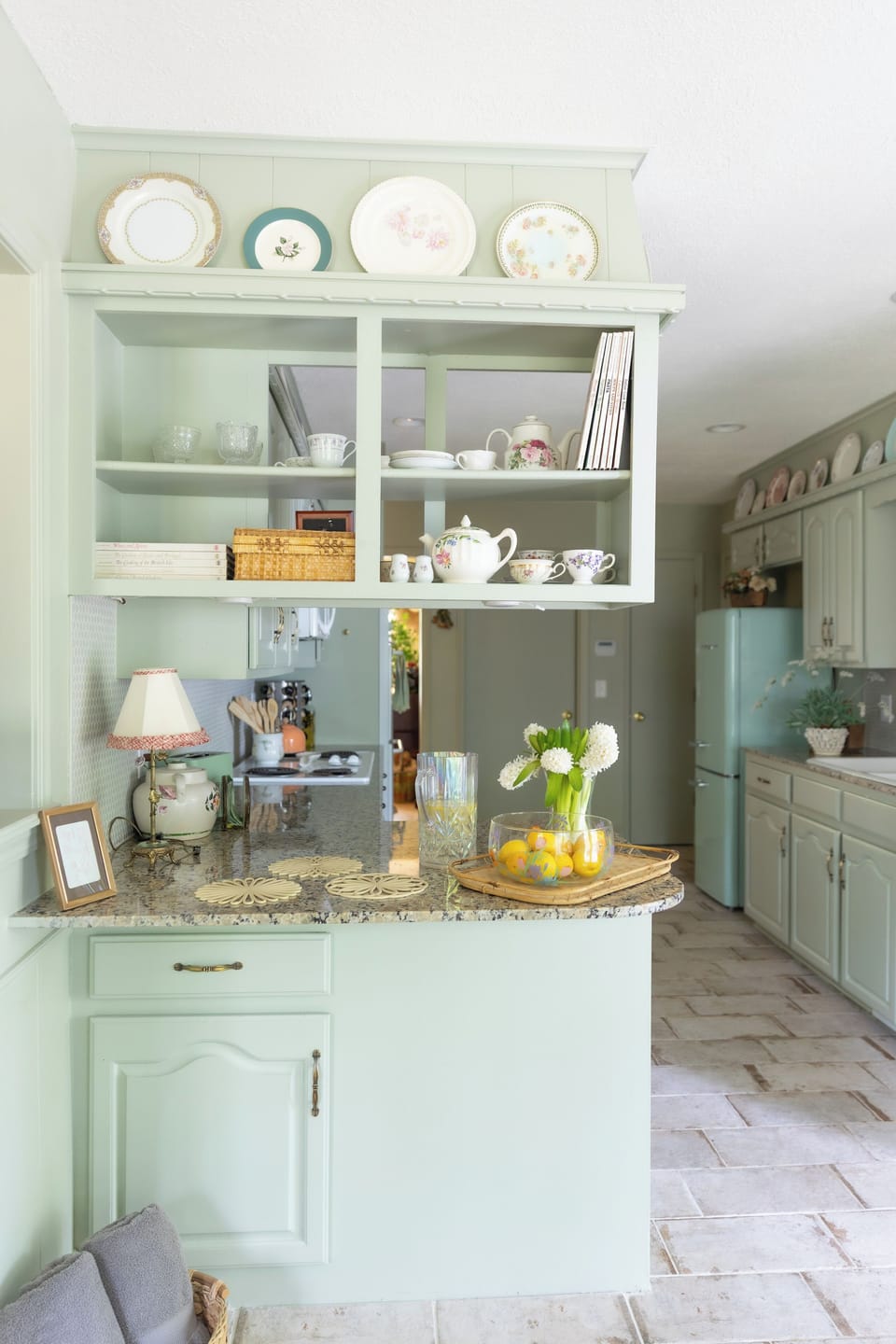 Kitchen stocked with vintage teacups and saucers for guests to use
