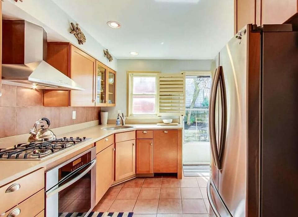 The updated kitchen features sleek, stainless tell appliances that bring a modern touch to the space.  The kitchen offers a convenient and stylish environment for your culinary endeavors. 