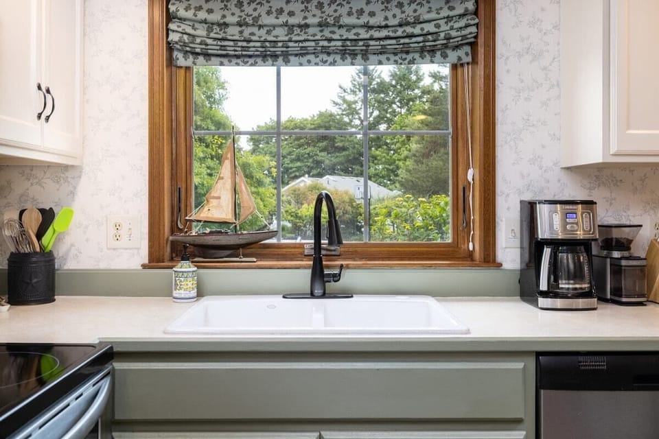 Enjoy views of Samish Bay beyond the colorful hydrangeas lining the back deck