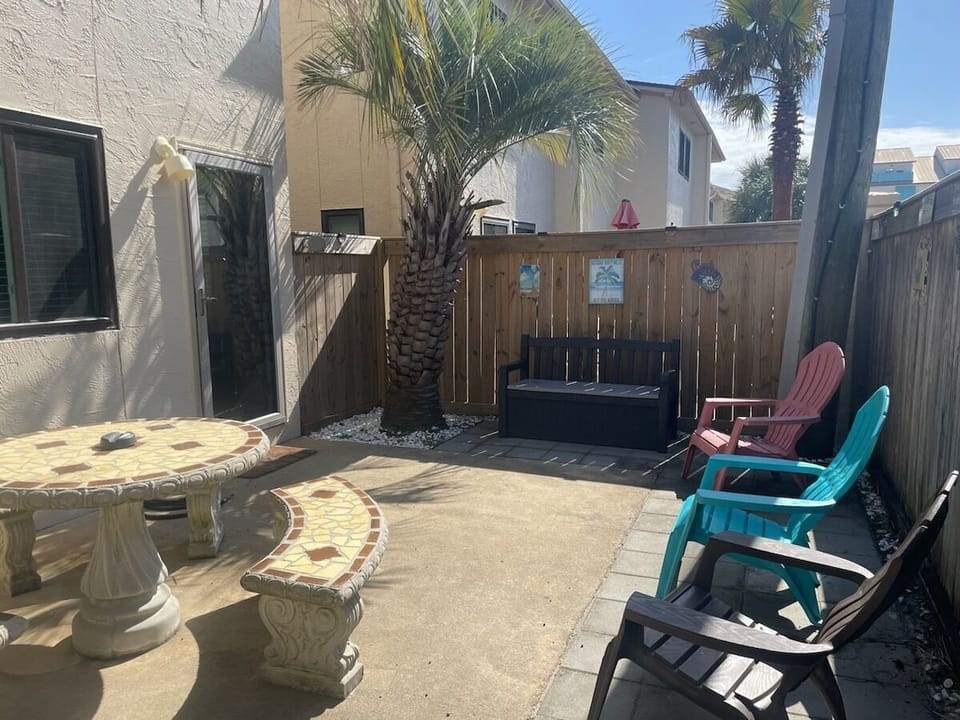 Private backyard patio.  Fully fenced in, retractable clothes line for wet towels and bathing suits, kids beach toys, beach chairs as available for your use. You can also rent chairs & umbrellas on the beach.
