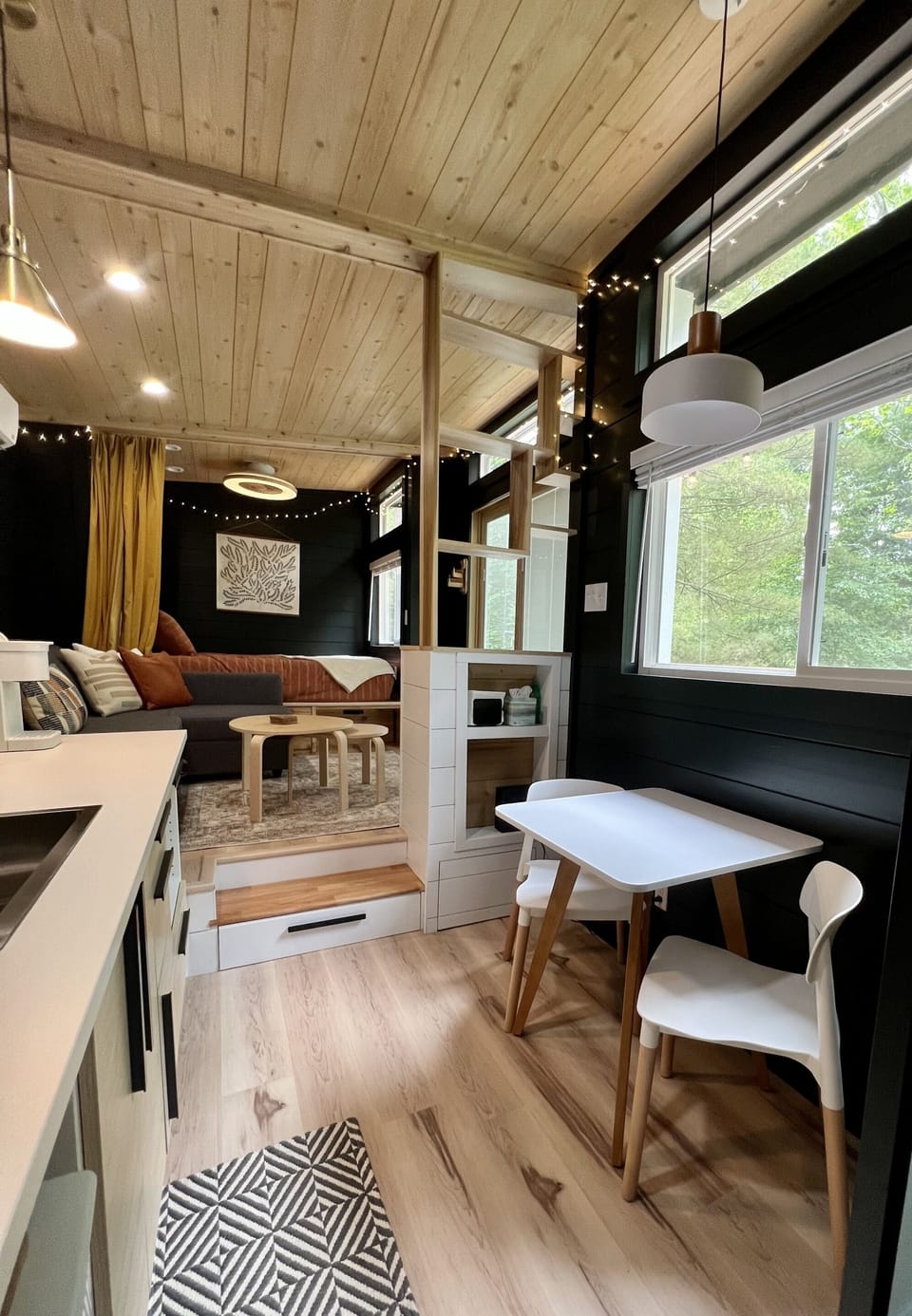 There's lots of windows to let in plenty of natural light (with blinds on all the lower windows for privacy); the kitchen table is a great spot for eating or checking up on email.  