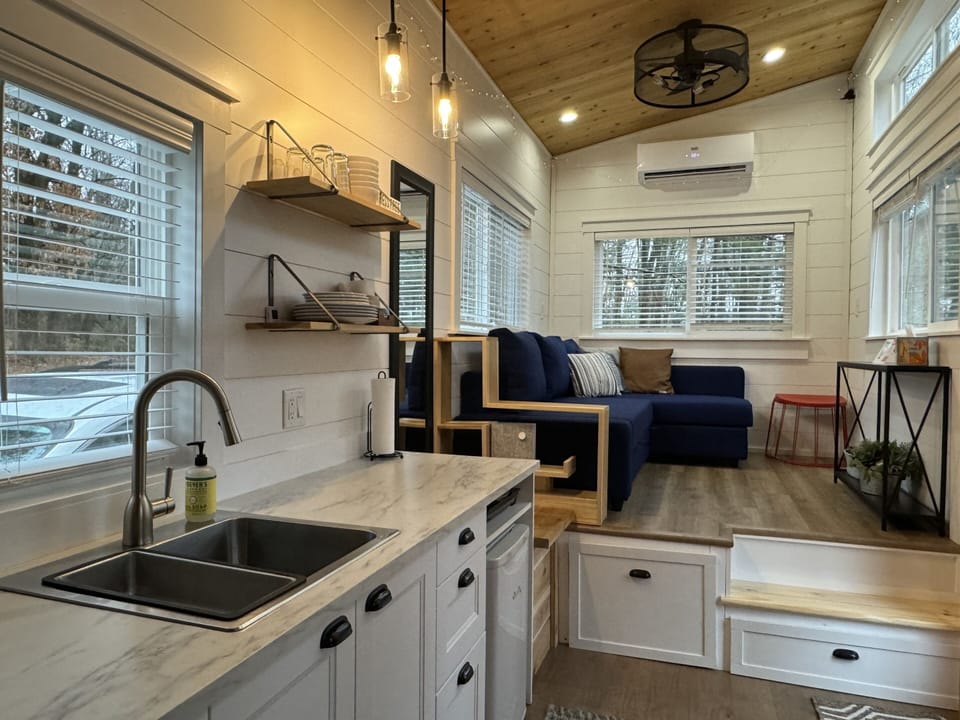The kitchen and living area provide plenty of space to prepare a great meal and relax together!