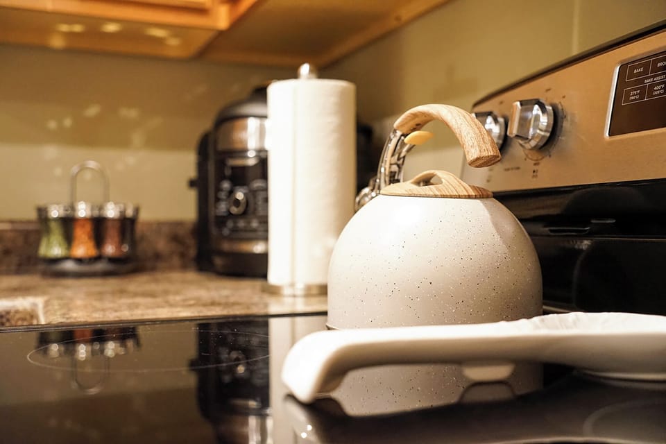 Warm, modern kitchen details with stylish kettle and handy appliances