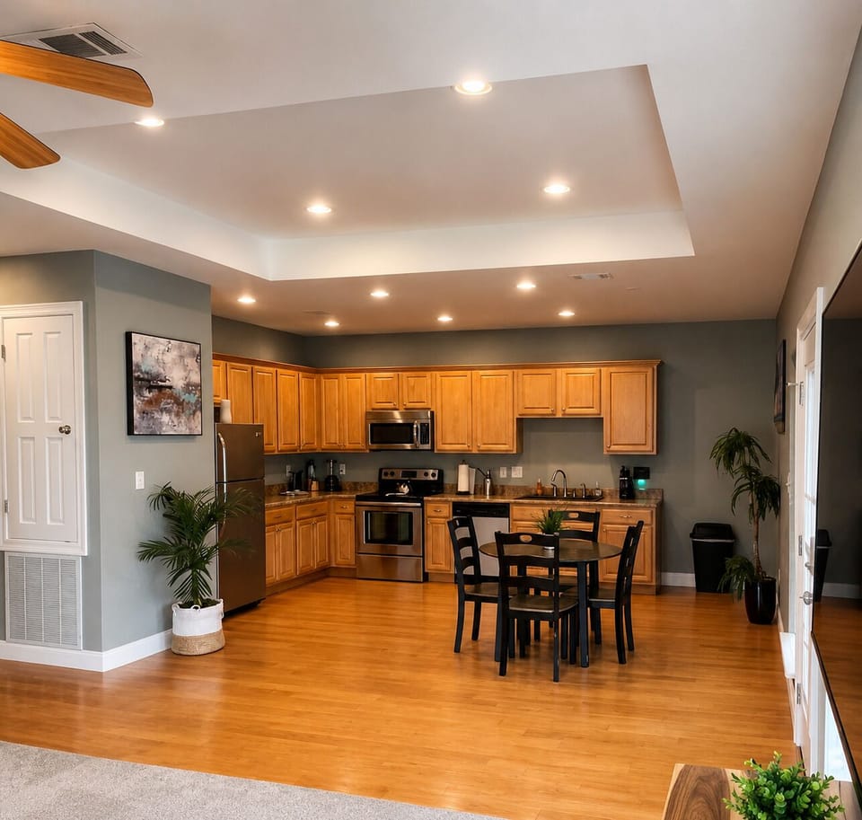 Bright open kitchen with stainless appliances and cozy dining space