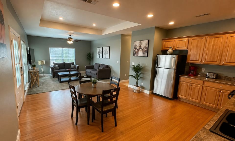Bright open-concept living, dining, and kitchen with cozy seating
