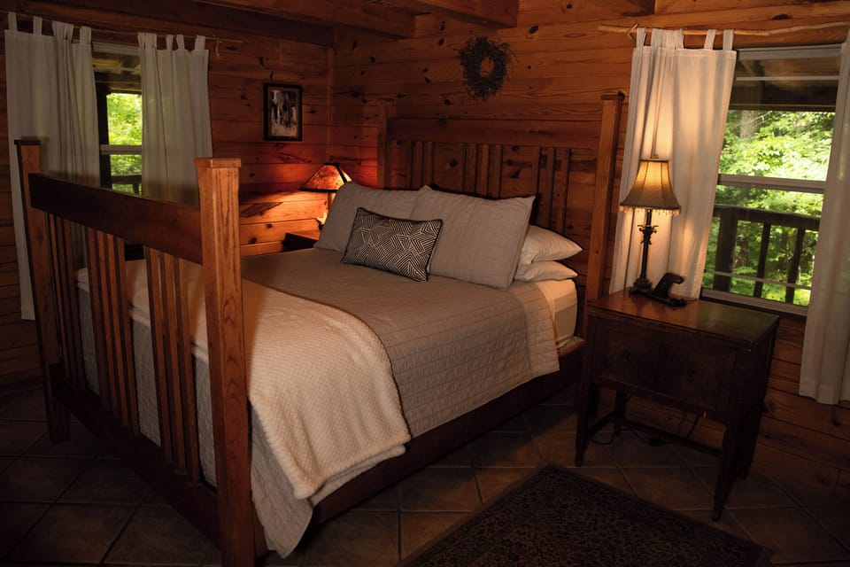 Queen bed in downstairs private bedroom.