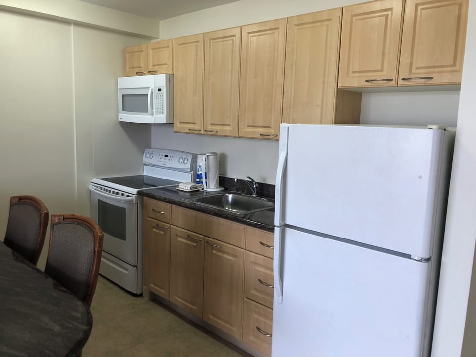 Your fully equipped kitchen features modern appliances and ample storage, making it easy to prepare meals and feel right at home during your stay.