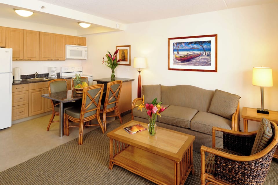 Your bright, open living space combines a fully equipped kitchenette, cozy dining nook, and relaxing sitting area—perfect for unwinding after island adventures or enjoying casual meals together.