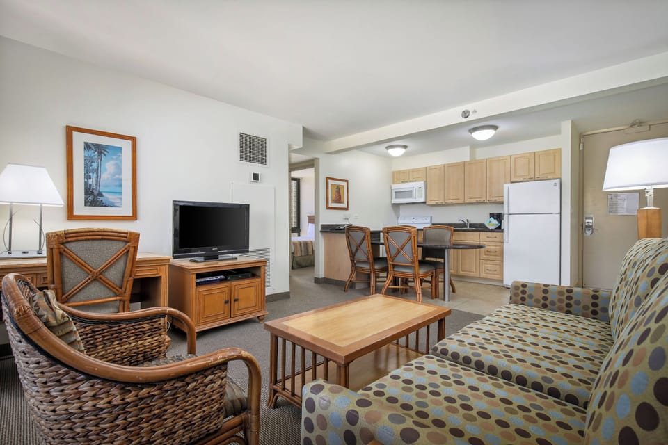 Picture yourself unwinding in this inviting space where the living room flows seamlessly into your fully equipped kitchen and dining area. Relax on comfortable seating, catch up on your favorite shows, and enjoy the convenience of everything you need for a