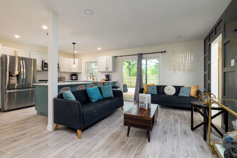 Bright open-concept living with modern style, kitchen and deck access