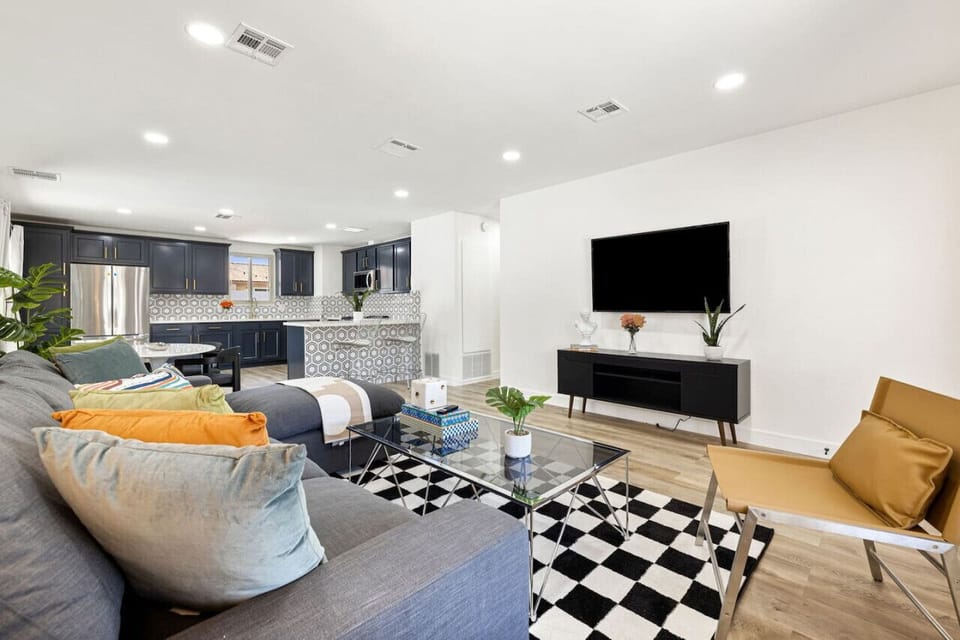 Spacious great room blends living & dining areas, ideal for gathering & relaxing.