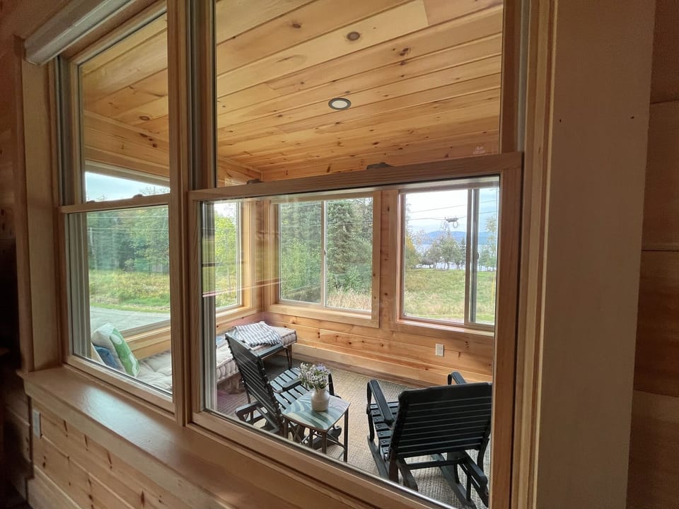 View of porch and lake from living room