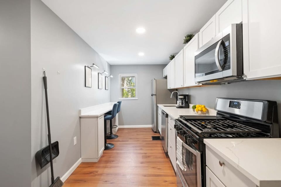 Kitchen: fully stocked with stainless pots & pans, knives, utensils, toaster, microwave, etc.