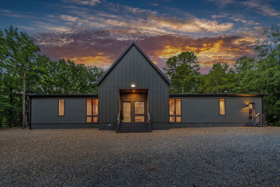Exterior Bliss: Stunning modern cabin surrounded by nature, perfect for your getaway adventure!