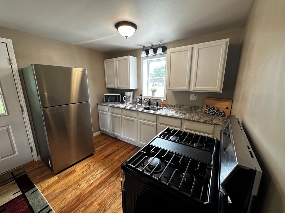 Full Kitchen including fridge, oven, microwave, and all cooking essentials. 
