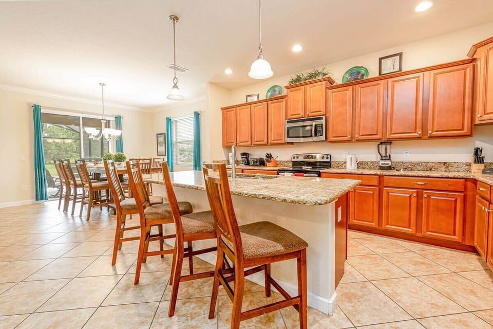 An equipped kitchen with seating for easy meal prep.