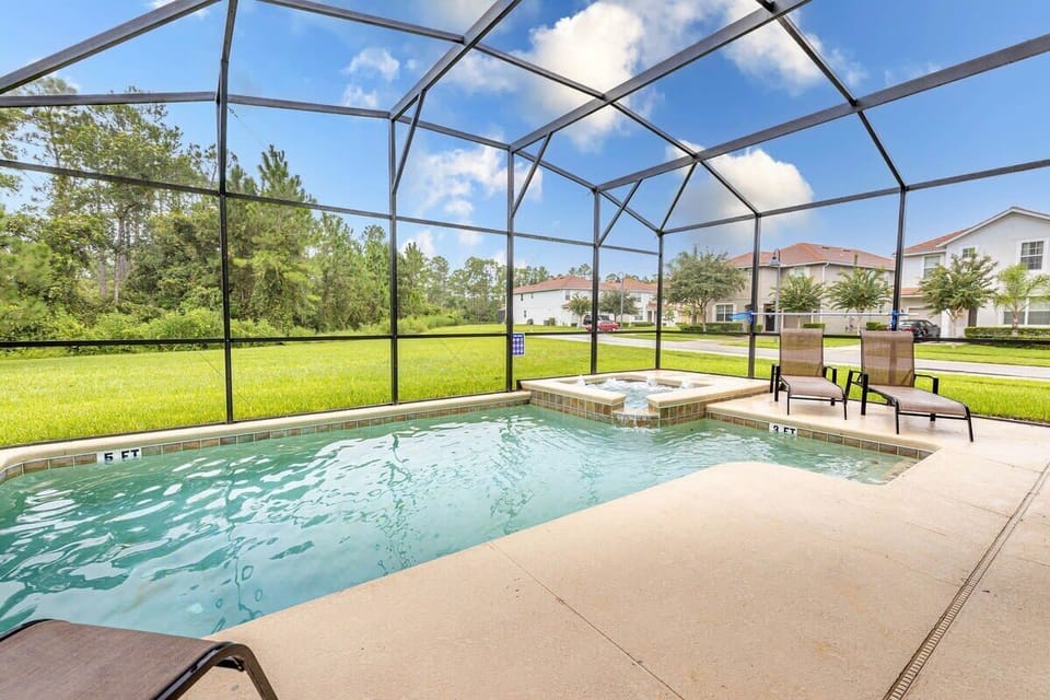 A heatable private pool with dining and seating area.