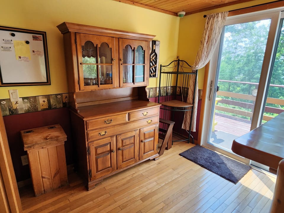 Dining area #2 with view of lake and sliding door to deck