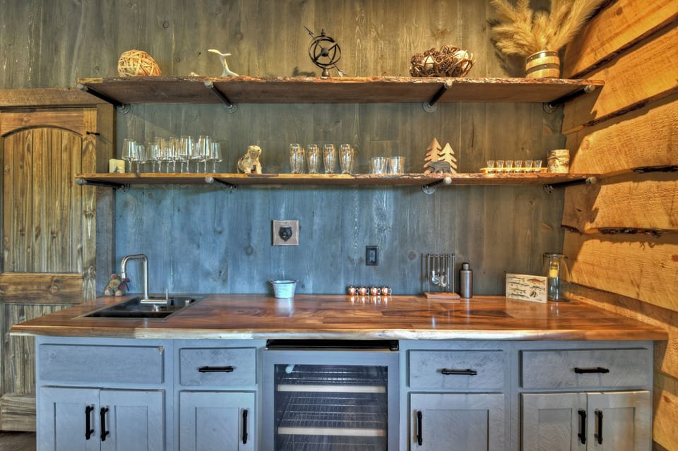 Basement bar with beverage fridge