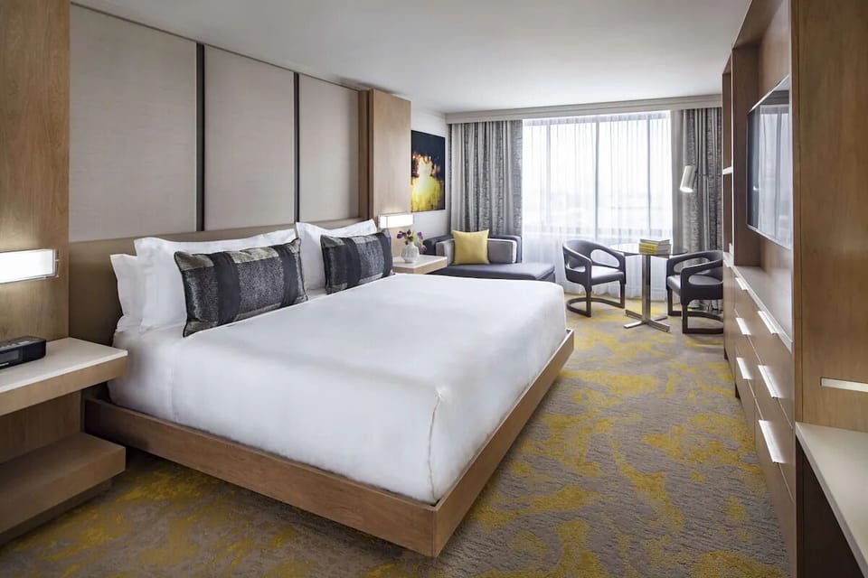 Unwind in a spacious king room with skyline views.