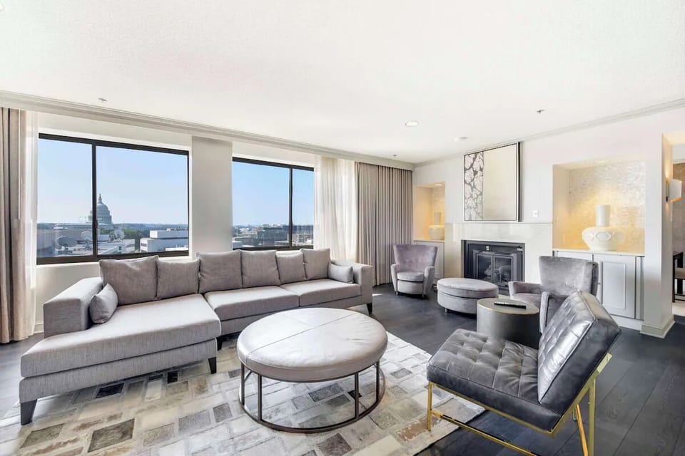 Gather in the airy living room with sweeping city views.