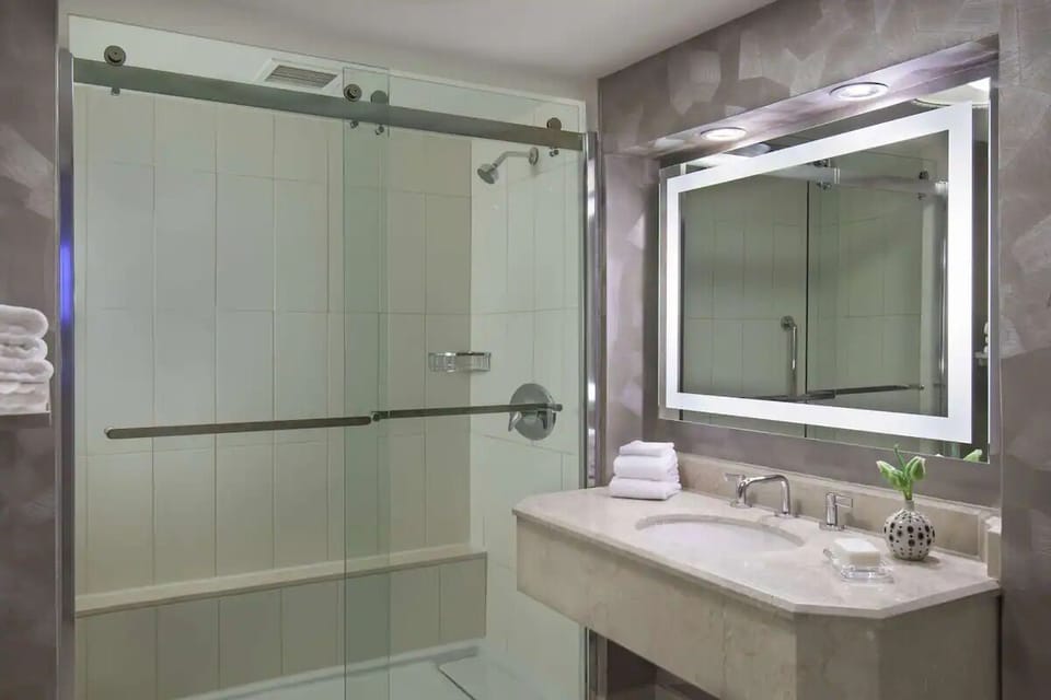 Start your day at a glowing vanity with ample counter space.