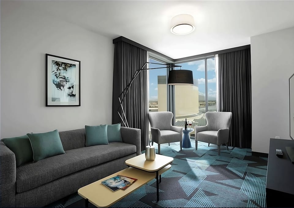 Settle in on the sofa and savor sunlit city views.