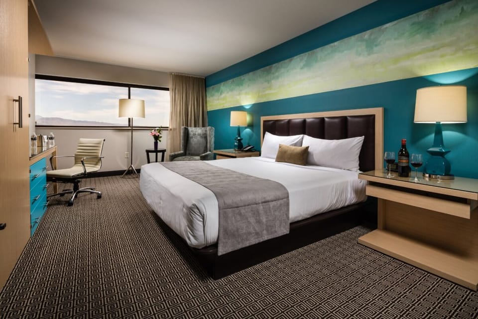 Drift off in a serene king bed with soothing colors.