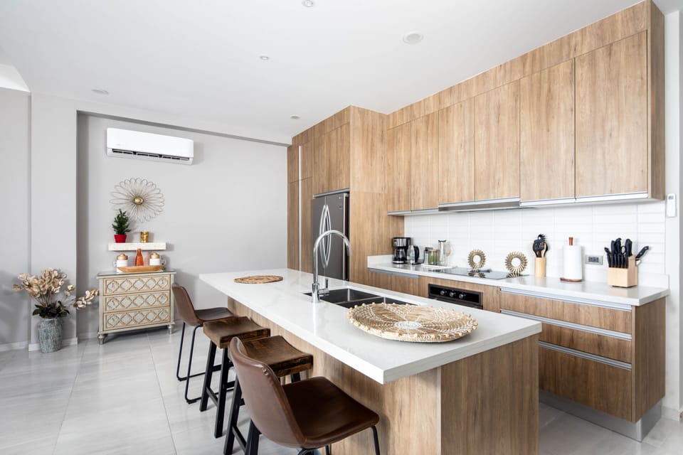 The kitchen has every appliance including stovetop, oven, microwave, D/W & W/D