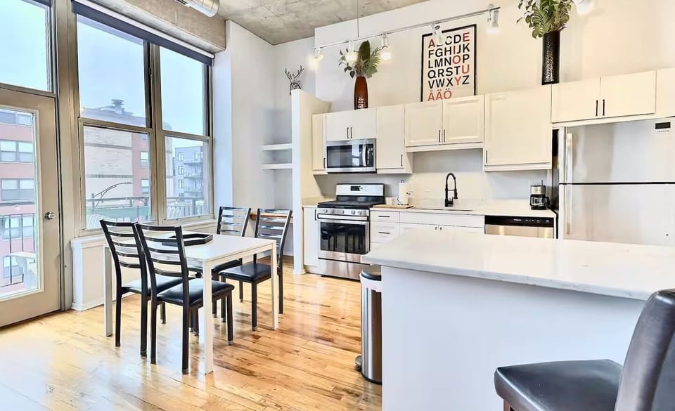 Large island and dining table, great space for entertaining.