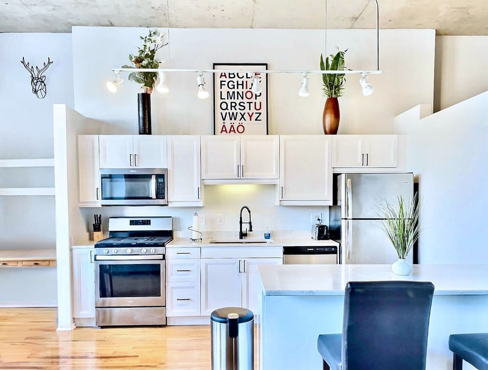 Fully stocked updated kitchen with great space for mini bar or workspace to left
