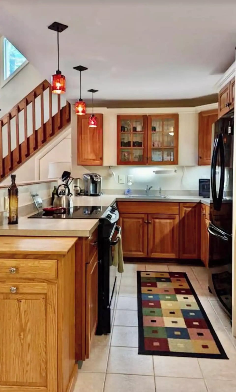 Well stocked kitchen open to living room area
