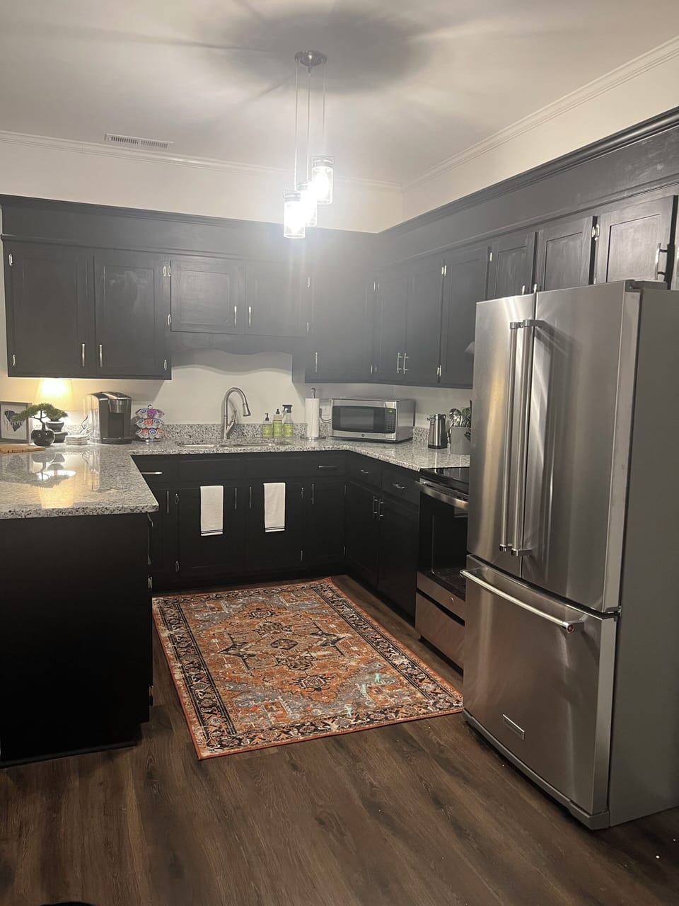 Kitchen is stocked with all full size appliances and tons of cooking utensils 