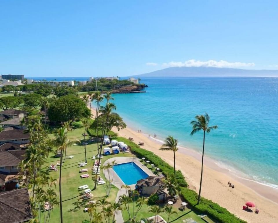 Soak in sweeping ocean views beside a resort-style pool.