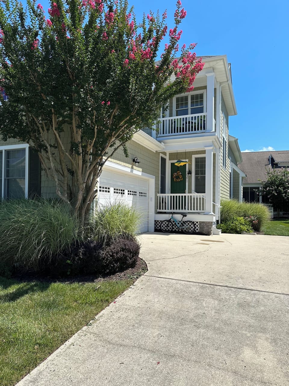 Front entrance with garage. 
Garage fully equipped with beach equipment 