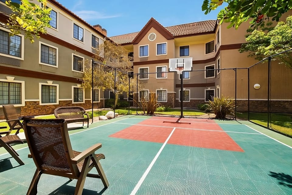 Play a quick game on the sunny on-site sport court.