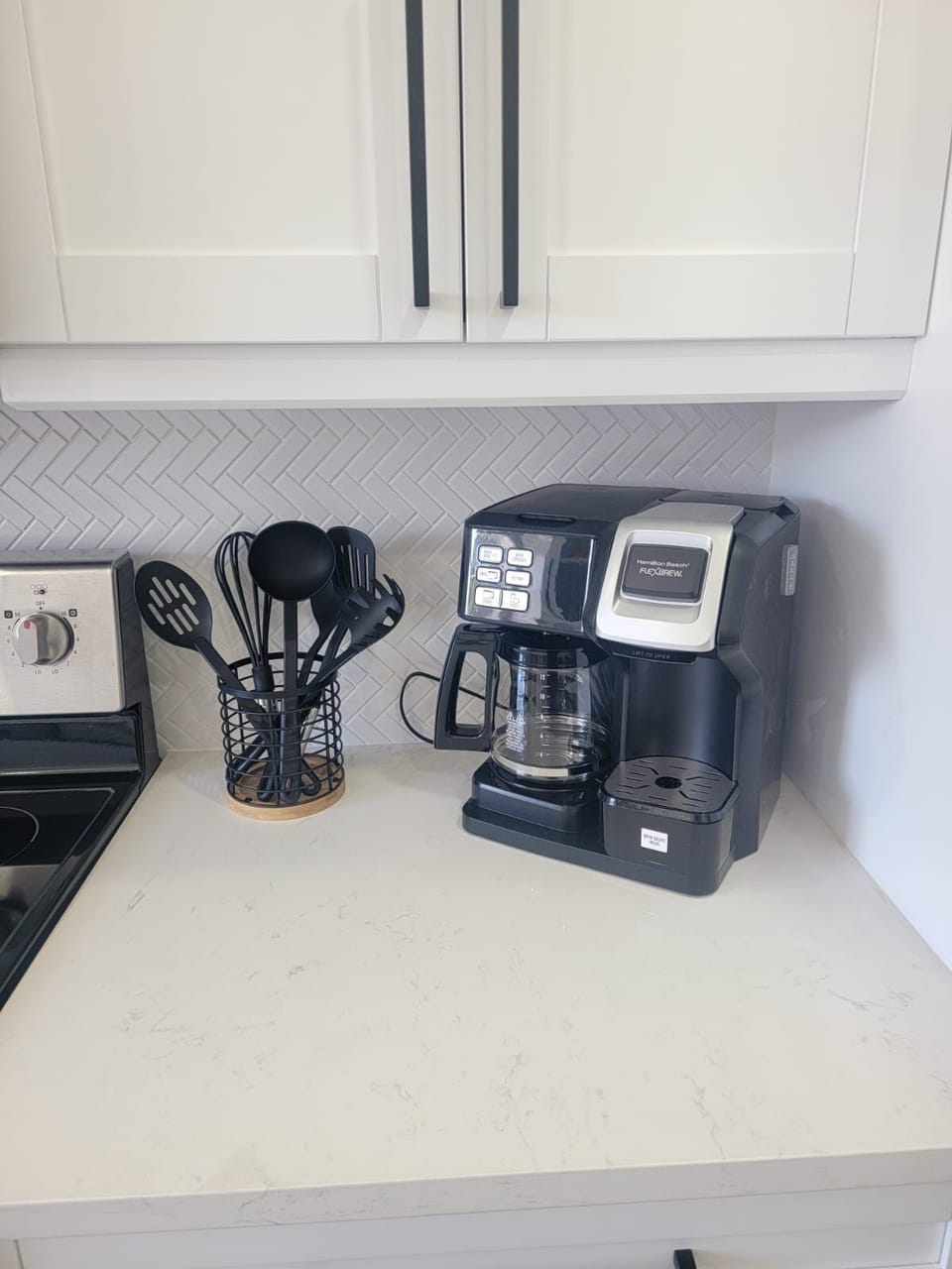 Coffee maker and kitchen essentials ready for your morning routine.