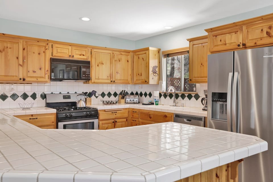 Modern kitchen island with comfortable seating and an open layout, perfect for casual dining, conversation, and gathering together.
