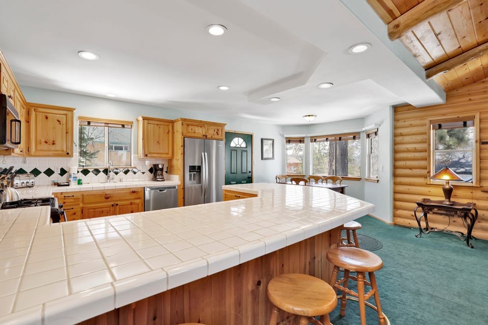 Modern kitchen island with comfortable seating and an open layout, perfect for casual dining, conversation, and gathering together.