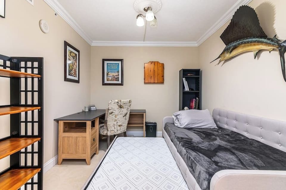 Den with a sofa bed, offering versatile sleeping arrangements.